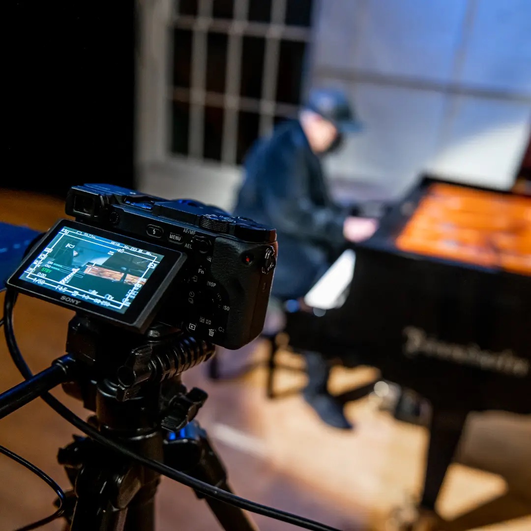 Robi Botos sat at the piano in the Ernest Balmer Studio