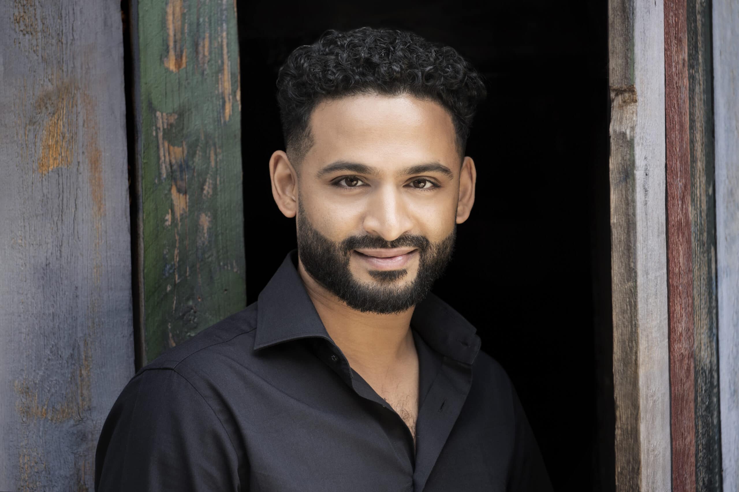 Jordan de Souza smiling at camera
