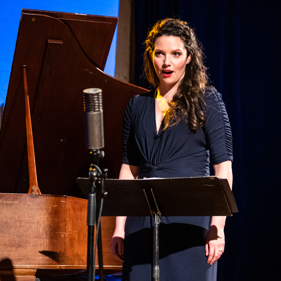 Mireille Asselin singing at a music stand