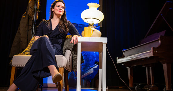 Photo of Mireille Asselin by Dahlia Katz Mireille Asselin sitting in a chair and smiling